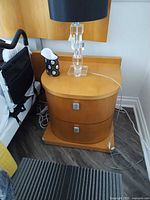 Nightstand front view beside bed