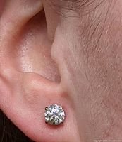 Earring worn on ear showing stone, setting and size