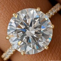 close-up of round lab diamond center and prong setting