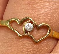 close-up of double-heart setting with diamond