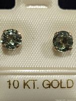 Front view of sapphire stud earrings in 10K gold settings