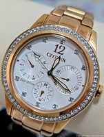 Front view of Citizen Eco-Drive watch showing dial, bezel crystals and sub-dials