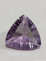 Front view of the trillion-cut amethyst showing facet pattern and colour