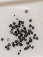Scattered loose black diamonds close-up