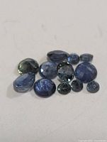 Group of twelve loose sapphires front view
