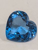 Heart-shaped faceted Swiss blue topaz gemstone front view