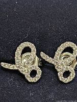 front view of both earrings showing loop design and pavé CZ