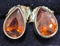 Front view showing teardrop garnet stones bezel set in silver