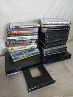 Sony DVD player with tray open and both DVD stacks