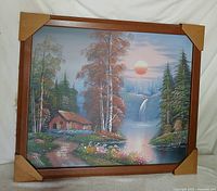 Frontal view of framed landscape print with cardboard corner protectors