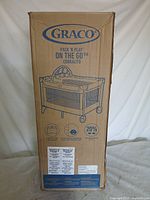 Front view of sealed Graco Pack 'N Play On the Go playard box