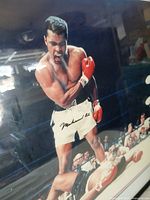 Close-up of Ali autograph on photograph