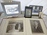 Overall lot showing album open and four mounted photos