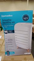 Front of retail box showing Homedics branding, model C550 stated, 2679 sq ft coverage