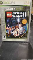 Front view of Xbox 360 LEGO Star Wars II Family Hits case