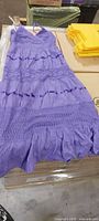Full view of purple tiered crochet dress front