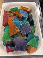 Top view of assorted Magna-Tiles showing variety of shapes and colors