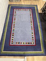 Full view of rug showing complete pattern and borders