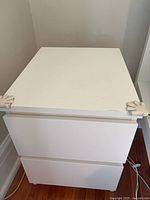 Front view of one Ikea 2-drawer bedside table