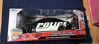 Front view of sealed RC police car box