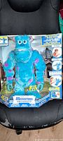 Front view of boxed Interactive Scare Sulley toy