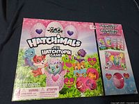 Front of sealed Hatchimals Hatchtopia Game box showing contents and branding