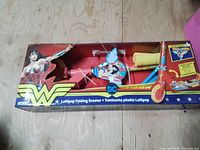 Box front showing Wonder Woman DC Lollipop Folding Scooter new in packaging
