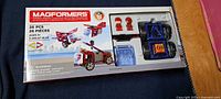 Front of sealed Magformers 26-piece set box showing contents and age rating