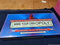 Front of sealed Make Your Own Opoly box