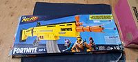 Front of retail box showing Nerf Fortnite AR-L blaster and details