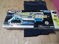 Front of sealed Nerf Hyper Siege-50 box showing product image and branding