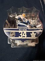 Front view of sealed Auston Matthews #34 limited edition figure in package