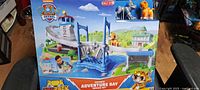Front of sealed PAW Patrol Cat Pack Adventure Bay Rescue Set box showing playset illustration and characters