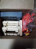 Unassembled plastic components and accessories inside carton