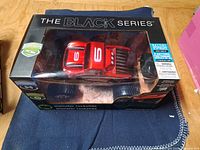 Front view of sealed box showing red Monster Rockslide truck