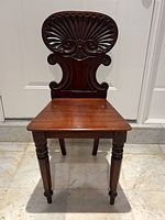 Full front view of carved wood chair
