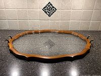 Top view of oval wood and glass tray