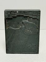 Front view showing full carved frog design and overall shape