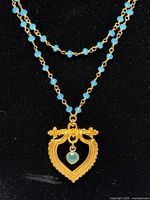 Close view of pendant and bead chain