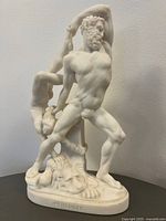 Front view of white ceramic Hercules sculpture on base