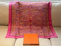 Full scarf spread on sofa with box in front