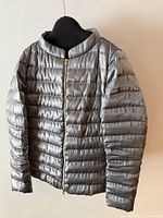 Front view of metallic silver Herno down jacket showing quilting and zipper