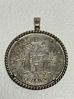 Reverse of Maria Theresa thaler coin in silver rope bezel