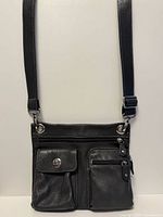 Front view of entire bag showing shape, strap and pockets