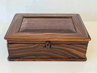 Front view of Brazilian rosewood jewelry box closed