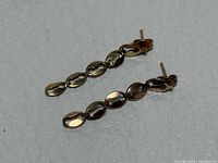 Full view of both earrings showing chain link design and overall length