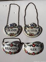 All four decanter labels front view showing designs and text