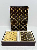 Box with two monogram decks displayed