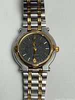 Front view of Gucci 9000L watch showing dial, bezel, bracelet