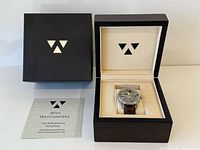 Watch in open presentation box alongside outer box and booklet